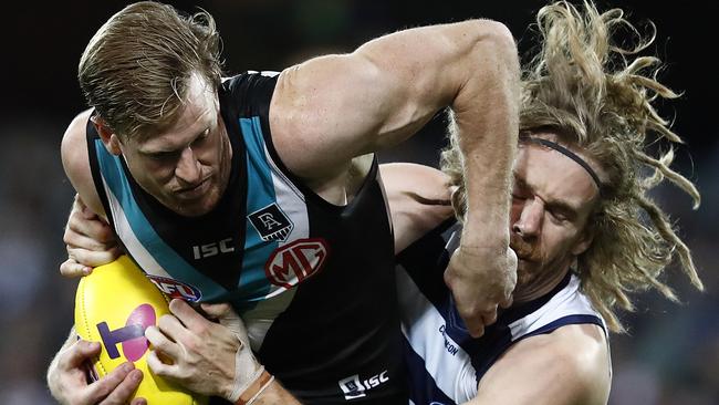 Tom Jonas and Cameron Guthrie come together when Port Adelaide took on Geelong in Adelaide last year.