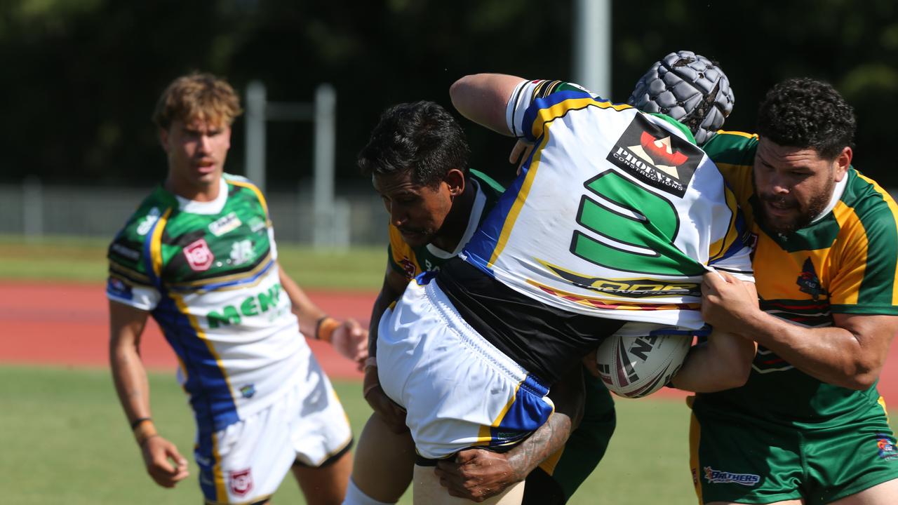 Cairns duo Ben Barba and Budhagi Gibuma drive Townsville's Dylan Gaggiano into touch. Picture: Matthew McInerney