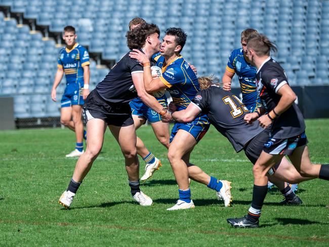 Mohamed Alameddine hits the line hard. Picture: Thomas Lisson