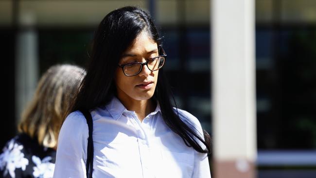 Liz Thomas, widow of pilot Stuart Weavell, leaves the Cairns Coroner's Court during the inquest into a plane crash on Cape York, which killed Mr Weavell and four QBuild contractors on March 11, 2020. The light plane crashed into sand dunes in bad weather during the approach to Lockhart River airport, killing all five men onboard. Picture: Brendan Radke