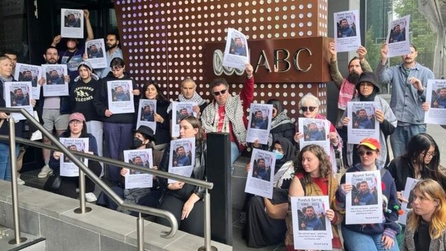 Supporters gathered outside the ABC offices in Southbank, Melbourne in silent vigil with posters of Mr Sarraj. Picture: Twitter/X (della79)