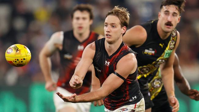 Darcy Parish wins one of his 43 touches against Richmond. Picture: Michael Willson/AFL Photos via Getty Images