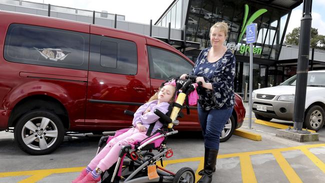 Jasmine Williams’ daughter April uses a wheelchair and needs accessible parking to get in and out of the car. Picture: Dean Martin