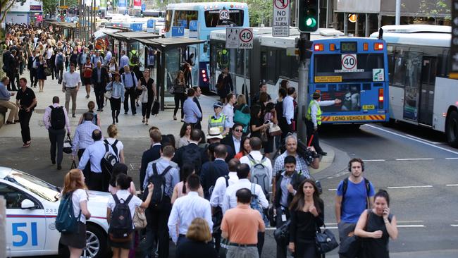 Buses line up as they drop passengers at Wynyard bus interchange on York Street. Picture: Cameron Richardson