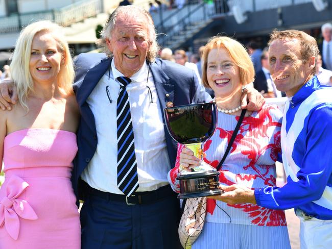 MELBOURNE, AUSTRALIA - FEBRUARY 26: Damien Oliver poses with trainer Gai Waterhouse and owner John Singleton after riding Castlereagh Kid winning Race 3, the Stow Storage Solutions Autumn Classic, during Melbourne Racing at Caulfield Racecourse on February 26, 2022 in Melbourne, Australia. (Photo by Vince Caligiuri/Getty Images)