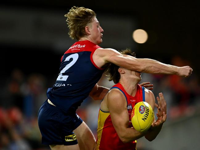 GOLD COAST, AUSTRALIA - MAY 06: Charlie Ballard of the Suns suffers an injury while challenging for the ball against Jacob van Rooyen of the Demons  during the round eight AFL match between the Gold Coast Suns and the Melbourne Demons at Heritage Bank Stadium, on May 06, 2023, in Gold Coast, Australia. (Photo by Albert Perez/AFL Photos via Getty Images)