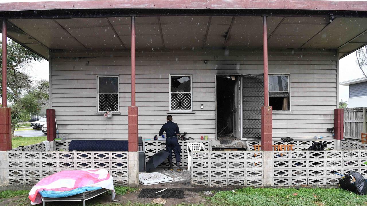 Multiple paramedics stood by at the scene of a reported fire that damaged vehicles and a home on Caloundra St. Picture: Patrick Woods.