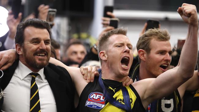 Jack Riewoldt and a beaming chief executive Brendan Gale enjoy the spoils of success. Picture: Dylan Burns/AFL Photos via Getty Images.