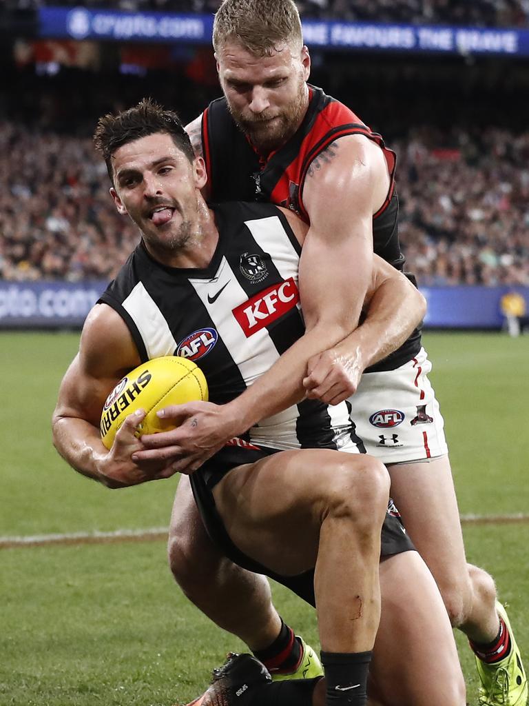 Jake Stringer tackles Scott Pendlebury. Picture: Darrian Traynor/Getty Images