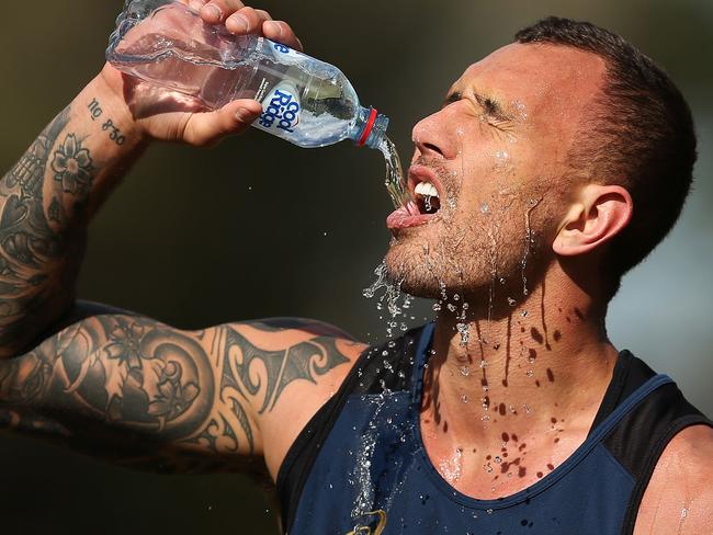 SYDNEY, AUSTRALIA - AUGUST 28: Quade Cooper of the Wallabies drinks water during an Australian Wallabies training session at Little Manly Beach on August 28, 2015 in Sydney, Australia. (Photo by Brendon Thorne/Getty Images)