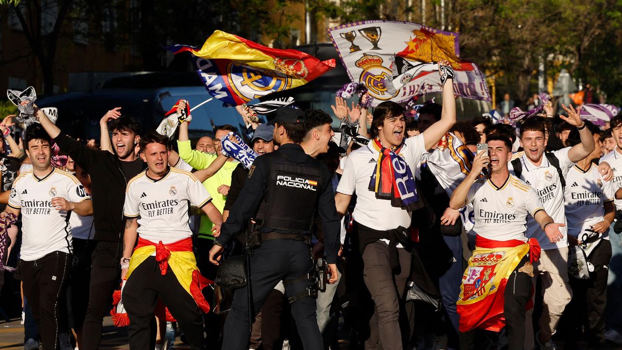 Real Madrid's supporters wait for their team's arrival. Picture: OSCAR DEL POZO / AFP