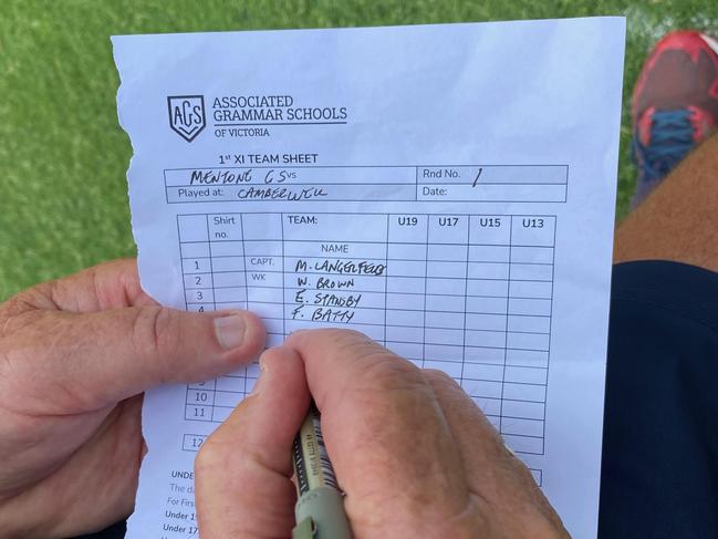 Peter Buchanan fills out the team sheet.