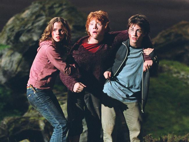 Grint (centre) with Harry Potter co-stars Daniel Radcliffe and Emma Watson.