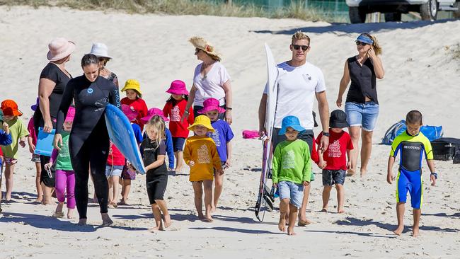 Pro surfer Bede Durbidge teaching Broadbeach Kindy students about surfing and swim saftey at Broadbeach beach. Picture: Jerad Williams