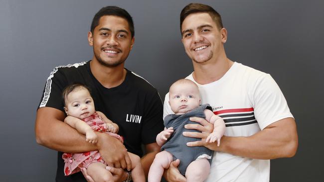 Anthony Milford poses with daughter Ariana and Kodi Nikorima poses with son Zavier in March last year. Picture: AAP Image/Claudia Baxter