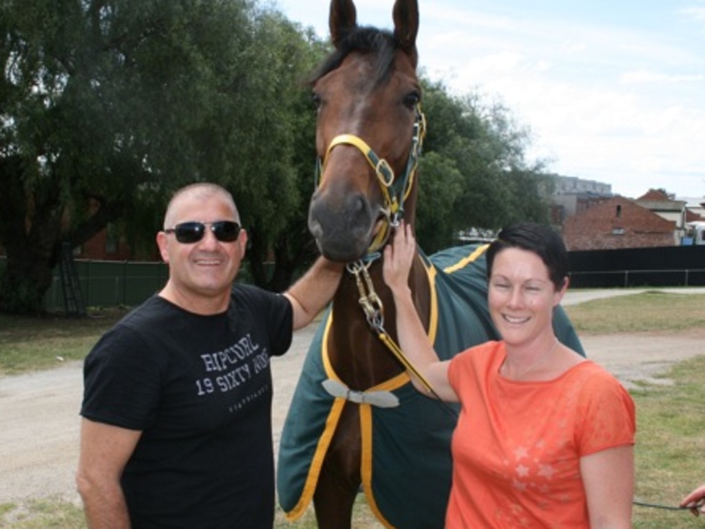 Bill Vlahos and his wife Joanne with one of their horses before the punting club collapsed. Picture: Supplied.