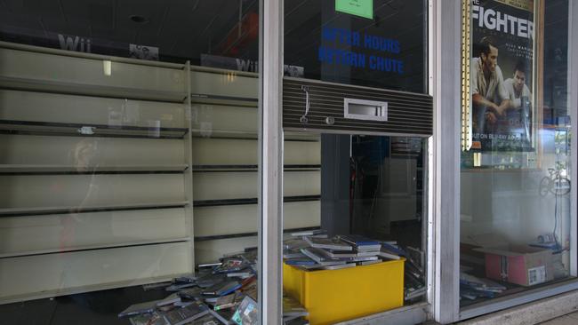 Returned DVDs piled up at Blockbuster Video at the 4-ways after the business closed. Picture: Lee Constable.