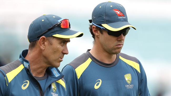 Travis Head with Justin Langer. Picture: Getty Images