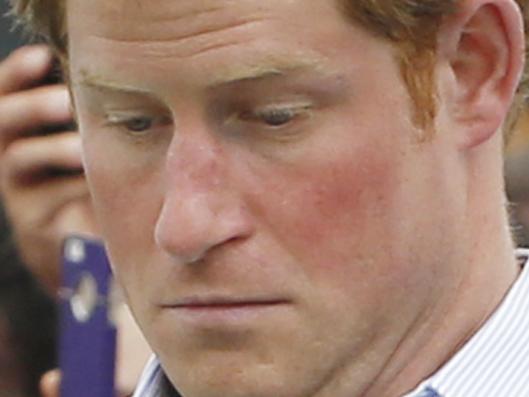 GLASGOW, SCOTLAND - JULY 29: Prince Harry plays a game during a visit to the Commonwealth Games Village on July 29, 2014 in Glasgow, Scotland. (Photo by Danny Lawson - WPA Pool / Getty Images)