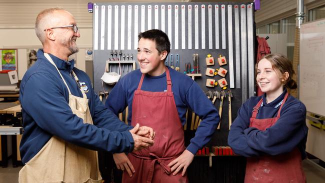 Head teacher of industrial arts at Corrimal High School Craig Mulder, with year 11 students Cullen Hoyn and Avalon Mooney. Picture by Max Mason-Hubers