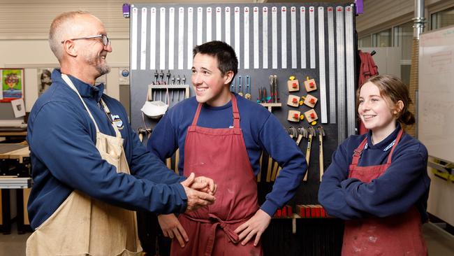 Head teacher of industrial arts at Corrimal High School Craig Mulder, with year 11 students Cullen Hoyn and Avalon Mooney. Picture by Max Mason-Hubers