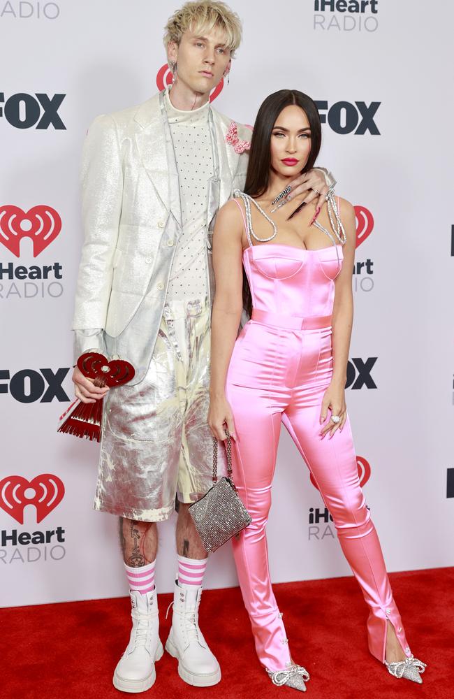 Machine Gun Kelly’s shiny shorts double as a mirror for touch-ups. Picture: Getty Images for iHeartMedia