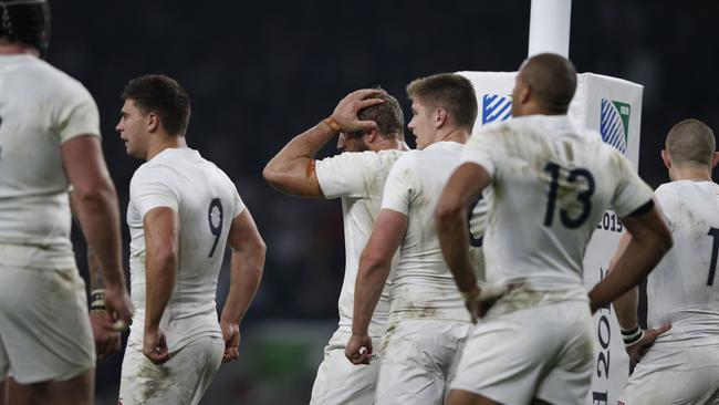 England's players react after losing a Pool A match of the 2015 Rugby World Cup between England and Australia at Twickenham stadium, south west London, on October 3, 2015. AFP PHOTO / ADRIAN DENNIS RESTRICTED TO EDITORIAL USE, NO USE IN LIVE MATCH TRACKING SERVICES, TO BE USED AS NON-SEQUENTIAL STILLS