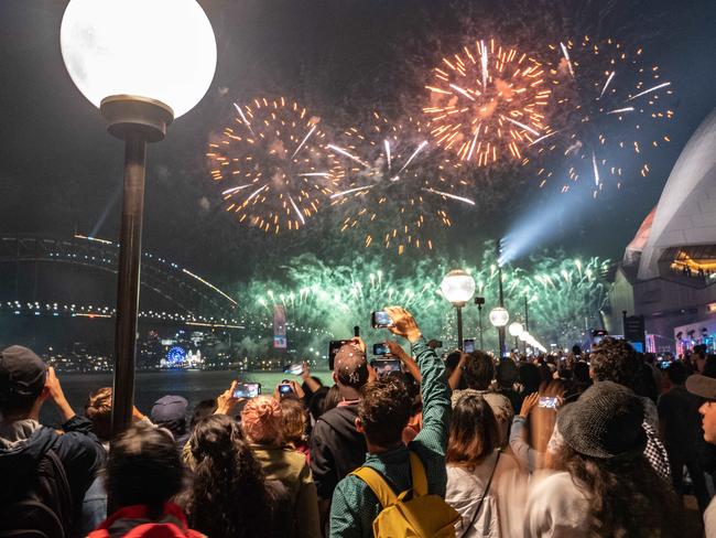 SYDNEY, AUSTRALIA - NewsWire Photos 31 DEC, 2022: People are seen celebrating on the crowded foreshore of Circular Quay in Sydney the New Year's Eve   Picture: NCA NewsWire / Flavio Brancaleone