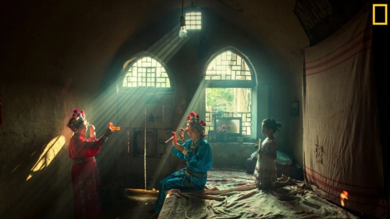 Actors prepare for an evening opera performance in Licheng County, China. The photographer spent the whole day with these actors from make-up to stage. Picture: Huaifeng Li /National Geographic Travel Photo Contest