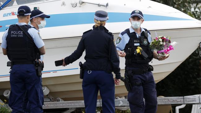 Police outside a home on Smith Sts in Pendle Hill where a woman in her 80s died from coronavirus. Picture: Jonathan Ng