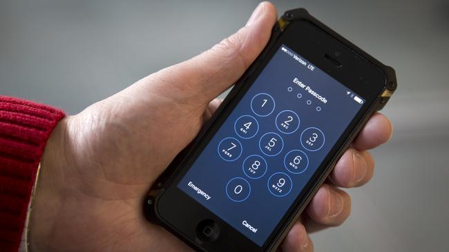 An iPhone is seen in Washington, Wednesday, Feb. 17, 2016. The San Bernardino County-owned iPhone at the center of an unfolding high-profile legal battle between Apple Inc. and the U.S. government lacked a device management feature bought by the county that, if installed, would have allowed investigators easy and immediate access. (AP Photo/Carolyn Kaster)