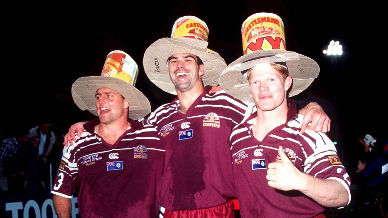 Maroons Billy Moore, Danny Moore and Brett Dallas celebrate the 1995 State of Origin.