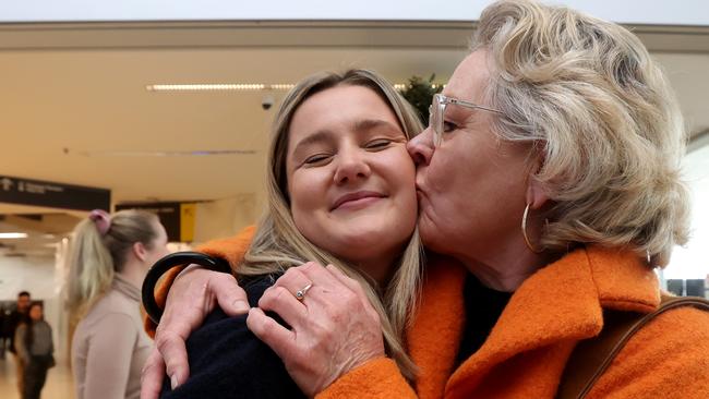 Jude Wainwright gives her daughter, Alice, a kiss after eights months apart. Picture: NCA NewsWire/Kelly Barnes