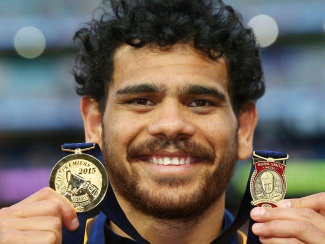 MELBOURNE, VICTORIA - OCTOBER 03:  Cyril Rioli of the Hawks poses with his premiership and Norm Smith Medal during the 2015 AFL Grand Final match between the Hawthorn Hawks and the West Coast Eagles at Melbourne Cricket Ground on October 3, 2015 in Melbourne, Australia.  (Photo by Michael Dodge/AFL Media/Getty Images)