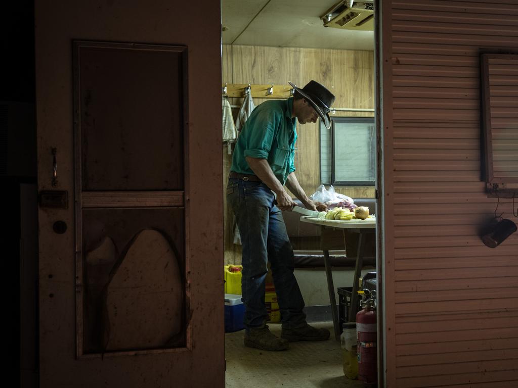 Leading Hand Jamie Kunze prepares dinner during mustering at Macumba Station, Oodnadatta. Picture: Matt Turner.