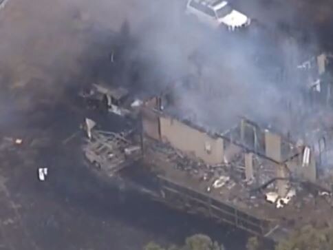 A bushfire rages towards Laidley. One home has already been destroyed. Picture: 7 News.