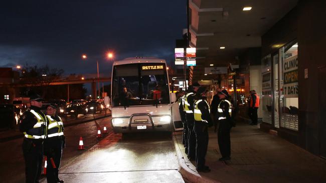 People load into a bus to be transported to La Mirage Reception and Convention Centre. Picture: AAP Image/Stefan Postles