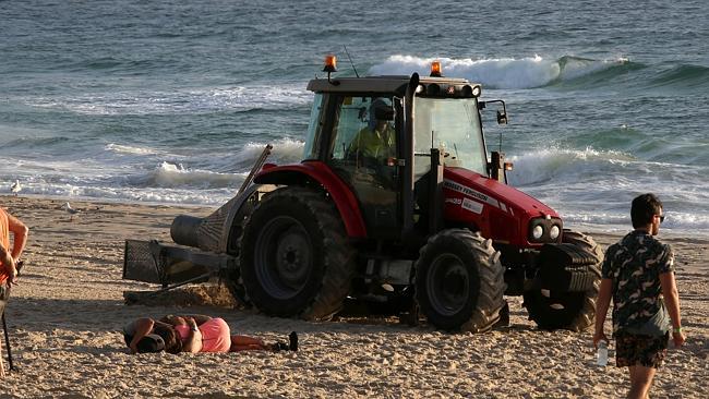 The Surfers Paradise clean-up gets underway. Pic by David Clark