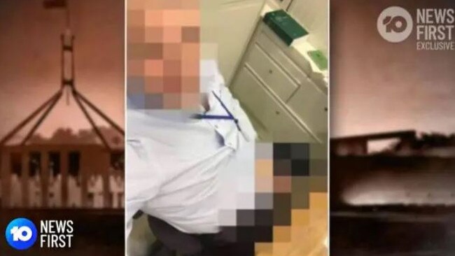 A male staffer sits on a desk and exposes himself, with the Parliament House rule book behind him. Picture: 10 News