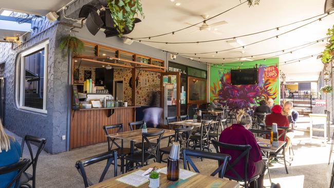 The outdoor dining area at Deedot Coffee House in Holland Park West. Picture: Mark Cranitch.