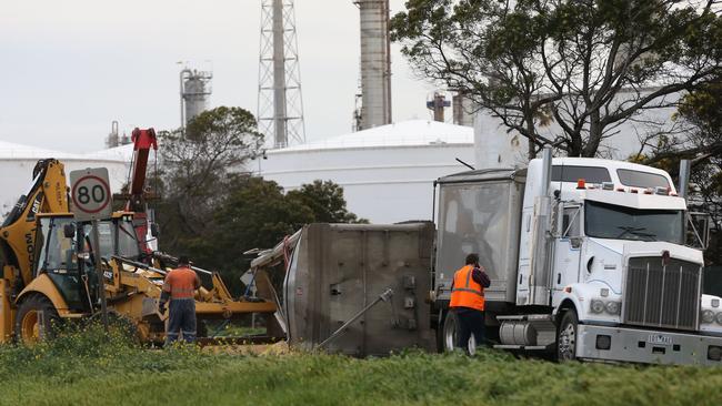 A trucks trailer rolled onto it's side spilling it's load of Soy meal onto Shell Parade, Corio. Picture: Peter Ristevski