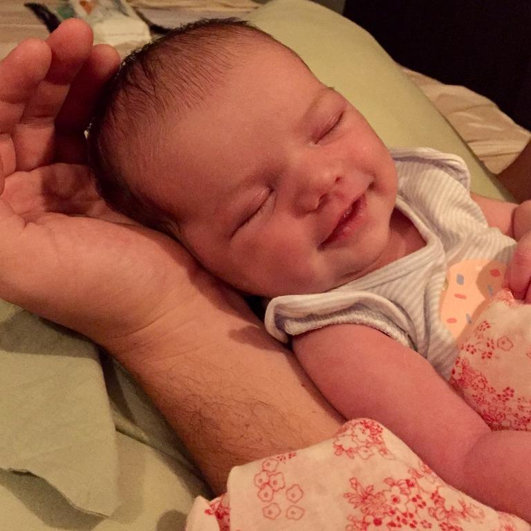 11 day old Aria dreaming happy dreams whilst being cradled in Daddy’s hand. Picture: Lana