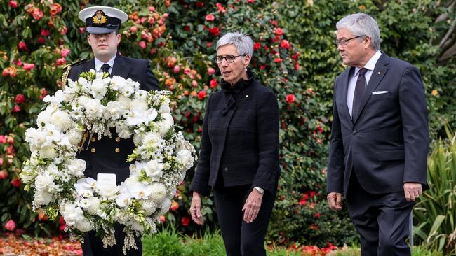 Victorian Governor Linda Dessau and partner Tony Howard lay a wreath to honour Queen Elizabeth II. Picture: Ian Currie