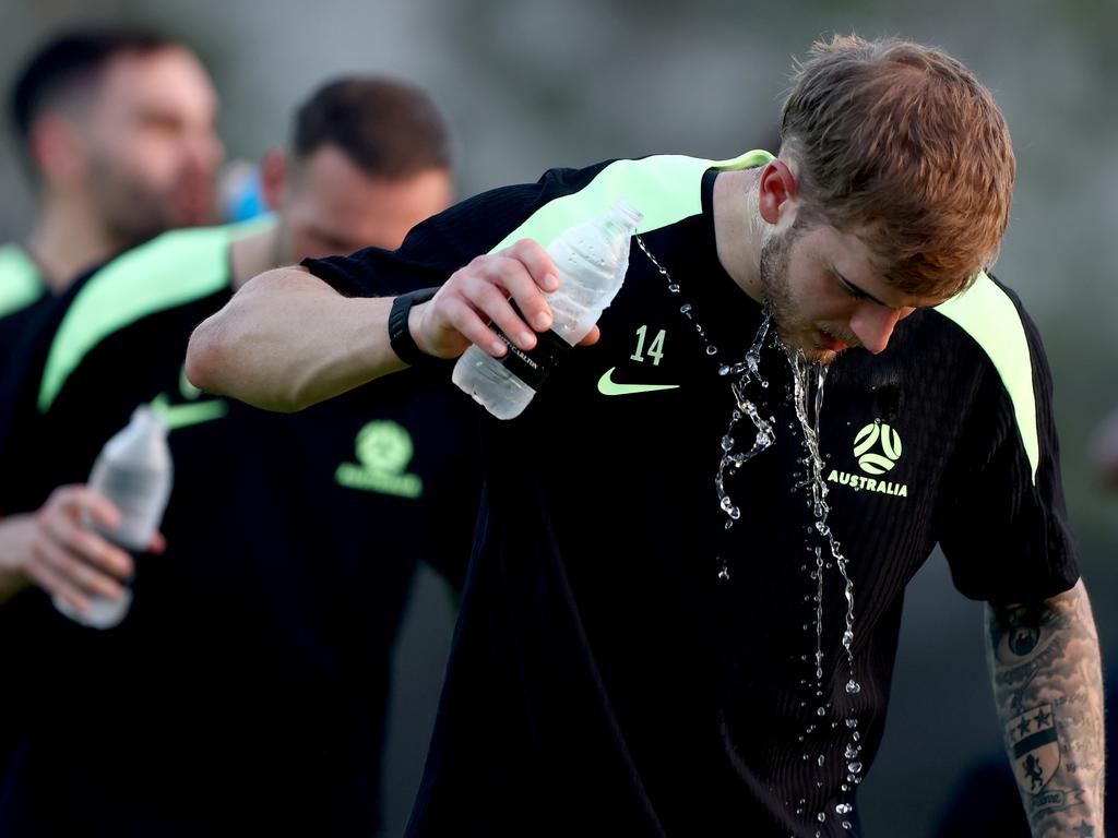 Riley McGree takes a water break during a session with a national training squad in the United Arab Emirates. Picture: Francois Nel/Getty Images