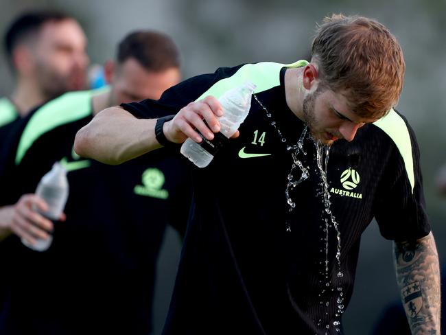 Riley McGree takes a water break during a session with a national training squad in the United Arab Emirates. Picture: Francois Nel/Getty Images