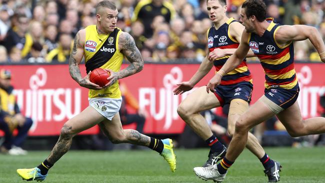 Dustin Martin outruns two Crows on Grand Final day. Picture: Sarah Reed