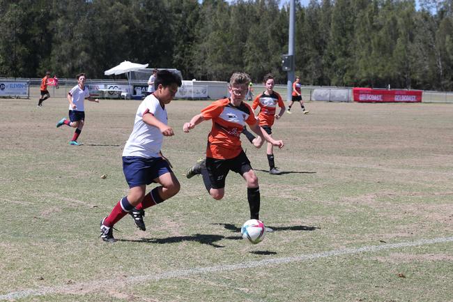 The Premier Invitational football tournament on the Gold Coast. TSS v Logan under-13s in action. Picture: Mike Batterham.