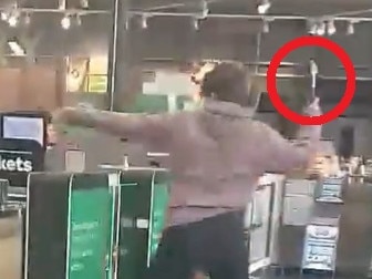 Person seen smashing Woolworths self-service checkout gate with a hammer. Picture: @akaWACA/X