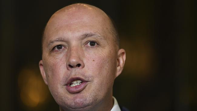 Australian Immigration Minister Peter Dutton speaks during a press conference at Parliament House in Canberra, Wednesday, December 6, 2017. (AAP Image/Lukas Coch) NO ARCHIVING