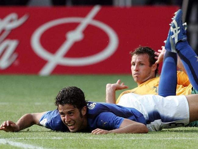 Neill (background) pleads his innocence as Grosso calls for a penalty. Pic: AFP